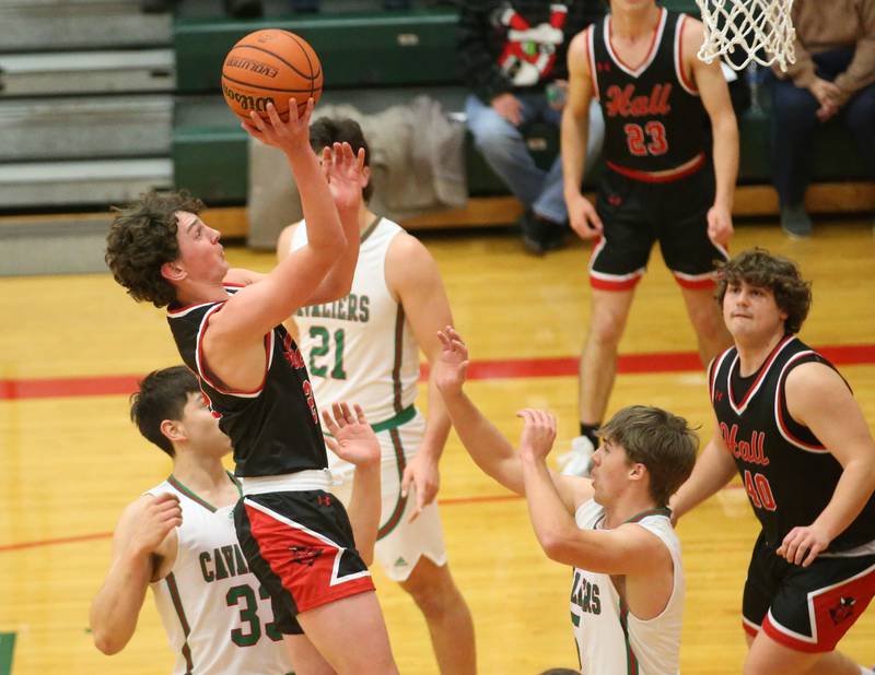 Hall's Jack Jablonski runs in the lane to shoot a shot over L-P's Seth Adams on Tuesday, Nov., 28, 2023 in AJ Sellett Gymnasium at L-P High School.