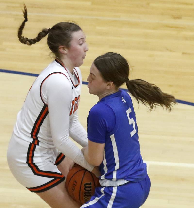 Crystal Lake Central's Addison Cleary and Burlington Central's Audrey LaFleur battle for control of the ball during the IHSA Class 3A Woodstock Regional Championship girls basketball game on Thursday, Feb. 15, 2024, at Woodstock High School.