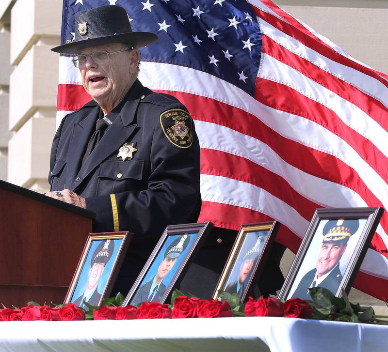 DeKalb County Sheriff Roger Scott makes some remarks during the DeKalb County Law Enforcement Officer’s Memorial Service Wednesday at the courthouse in Sycamore. The ceremony honors the 168 law enforcement officers killed in the line of duty in 2018, including the four in the pictures on the table that lost their lives in Illinois.