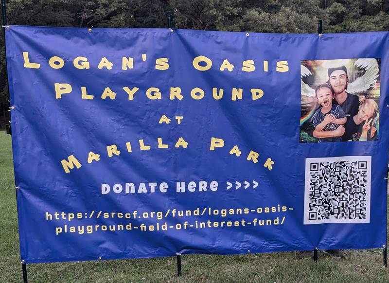 A banner promoting donations to Logan's Oasis Playground at Marilla Park, facilitated through the Starved Rock Country Community Foundation.