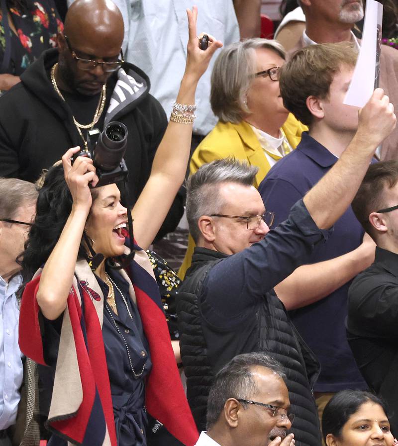 Families of Northern Illinois University candidates for graduation wave to their students during the first of two undergraduate commencement ceremonies Saturday, May 11, 2024, in the Convocation Center at NIU in DeKalb.