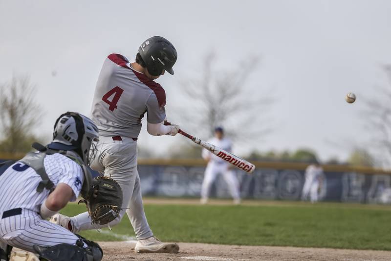 Plainfield North's Ryan O'Connor (4) connects on a pitch during baseball game between Plainfield North at Oswego East, Monday, April 28, 2025 in Oswego.