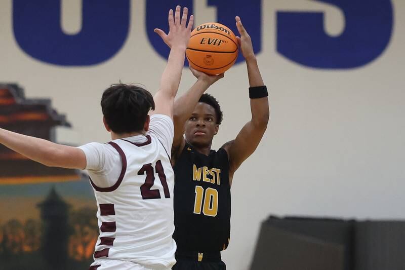 Joliet West’s Zion Gross puts up the deep shot against Mount Zion in the 2024 Riverside Brookfield Bill VanderMerkt Boys Basketball Tournament on Monday, Nov. 25, 2024 in Brookfield.