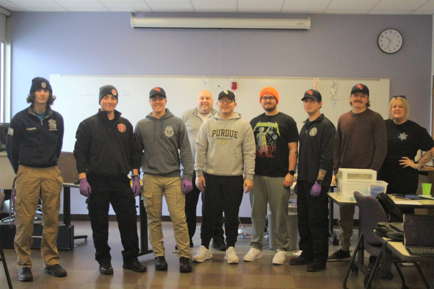 Area fire and ambulance personnel in the Illinois Valley Community College paramedic program at Ottawa Center are (from left) Clayton Wellenreiter, Tristen Beck, Caleb Beck, instructor Nick Fish, Tyler Walsh, Brady Mitchell, Brandon Bice, Dylan Kimak and Lauren Bangert.