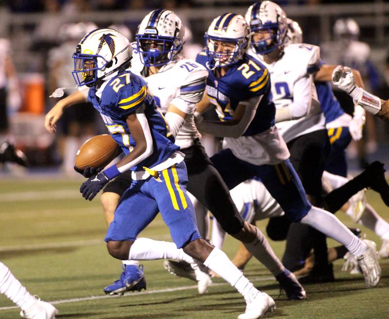 Wheaton North’s Printess Wynn runs the ball during a game against St. Charles North in Wheaton on Friday, Sept. 8, 2023.