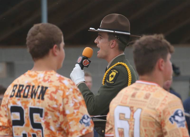 Illinois State Police Trooper and Honor Guard member Nicholas Spizzirri sings the National Anthem of the Illinois Valley Pistol Shrimp First Responder Night on Tuesday, June 17, 2025 at Schweickert Stadium in Peru.