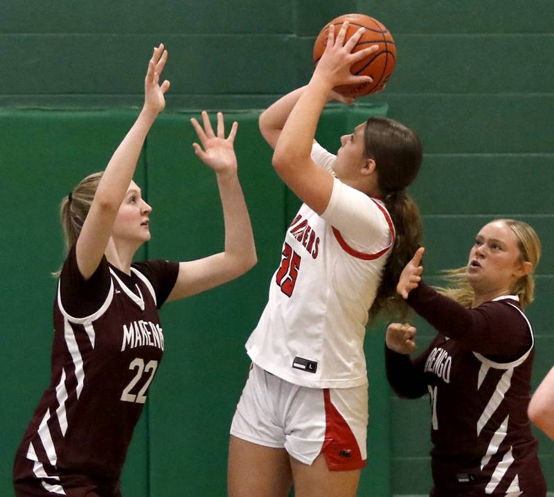 Huntley's Evie Freundt (center) shoots the ball between Marengo's Dayna Carr (left) and Marengo's Mia Feidt (right) during the girl’s game of McHenry County Area All-Star Basketball Extravaganza on Sunday, April 13, 2025, at Alden-Hebron’s Tigard Gymnasium in Hebron.