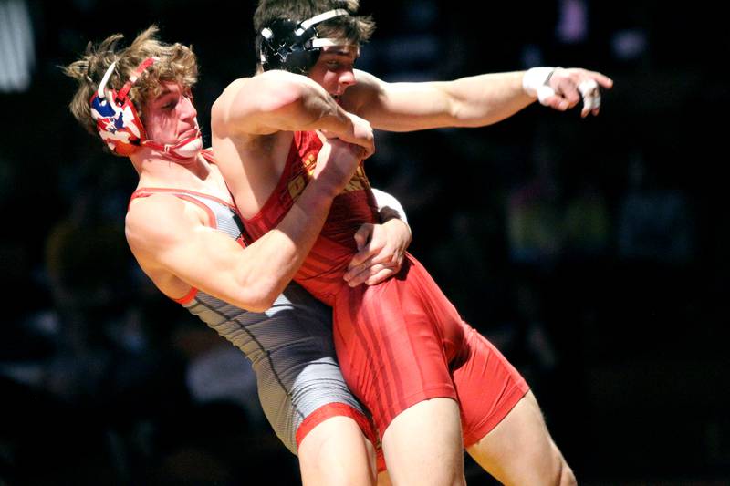 Yorkville's Luke Zook (left) takes down Batavia's Noah Ajazi in the 152-pound weight class in a dual meet at Batavia on Wednesday, Jan. 26, 2022.
