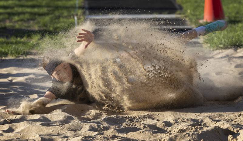 Rock Falls’ Maya Kobbeman splashes down in the long jump pit Thursday, May 8, 2025, during the girls Big Northern Conference track meet.