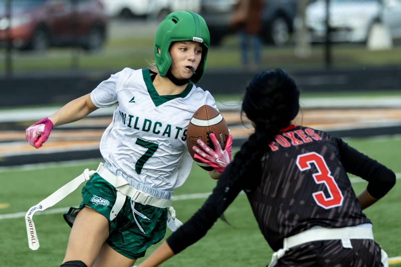 Plainfield Central's Grace Flanagan gains yardage during the IHSA Danville Sectional varsity flag football game against Yorkville at Plainfield East on Oct. 13, 2025.