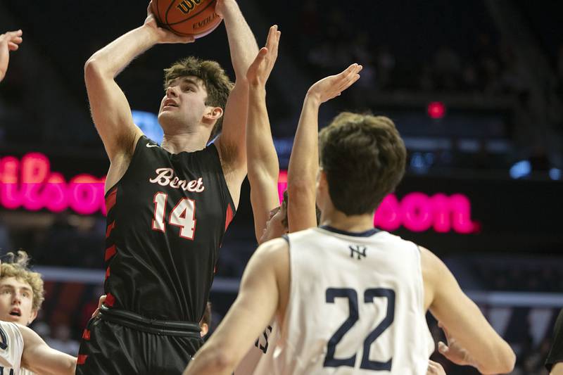 Benet Academy’s Parker Sulaver puts up a shot below the basket against New Trier Friday March 10, 2023 during the 4A IHSA Boys Basketball semifinals.
