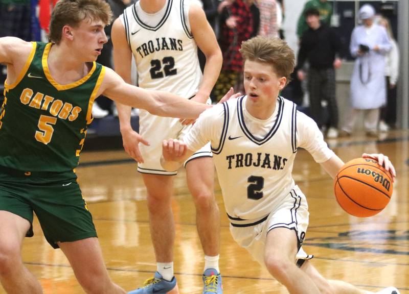 Cary-Grove’s AJ Berndt, right, moves past Crystal Lake South’s Carson Trivellini in varsity boys basketball on Wednesday, Dec. 3, 2025, at Cary-Grove High School in Cary.