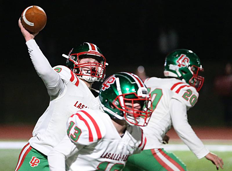 L-P quarterback Mason Lynch (3) throws the ball down the field against Morris during the Class 5A round one football game on Friday, Oct. 28, 2022 in Morris.