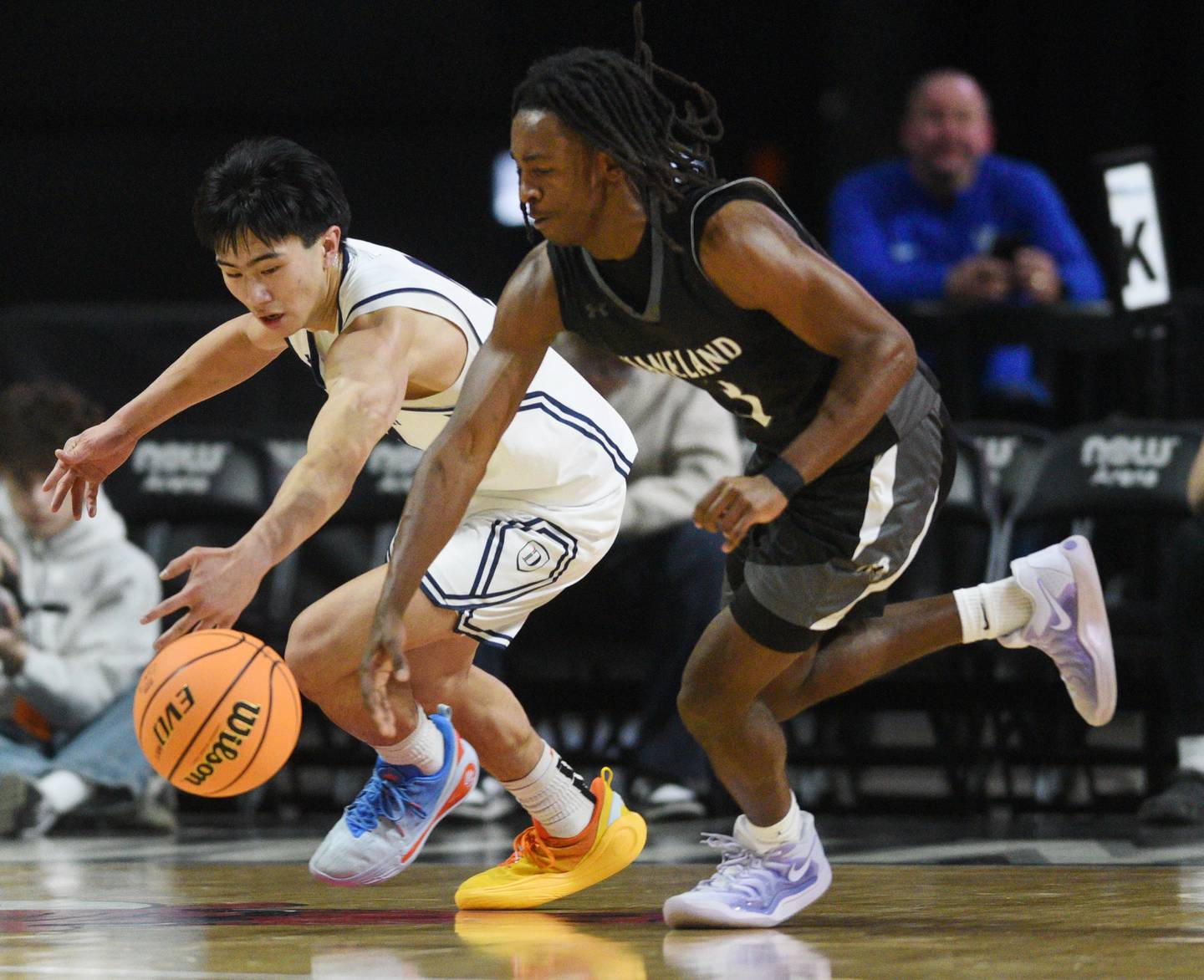 Kaneland's Marshawn Cocroft, right, steals the ball from DePaul College Prep's Rykan Woo during the Class 3A boys supersectional at NOW Arena on Monday, March 10, 2025 in Hoffman Estates.