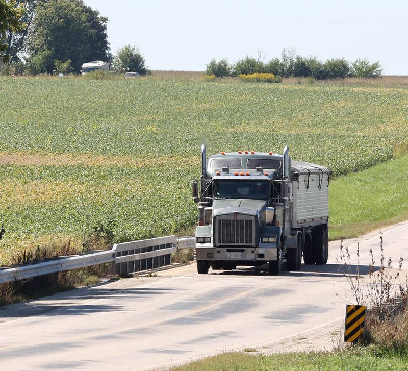 Shaw Local file photo – A semitrailer truck drives on a Perry Road bridge that goes over Battle Creek Friday, Sept. 9, 2022, in Pierce Township just south of DeKalb. The bridge is expected to close starting Sept. 3, 2024, for construction, with a targeted completion date of November 2024.