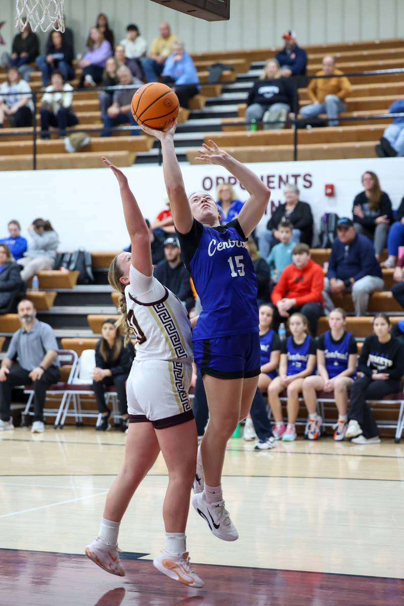 Clifton Central's Lia Prairie goes for a layup under pressure from Watseka-Milford's Noelle Schroeder during the Warriors' 60-49 victory over Clifton Central on Saturday, Jan. 10, 2026.