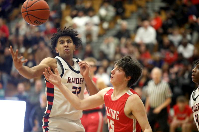 Bolingbrook’s JT Pettigrew (left) and Palatine’s Kasey May go for the ball during the Jack Tosh Holiday Classic semifinals at York High School in Elmhurst on Friday, Dec. 29, 2023.