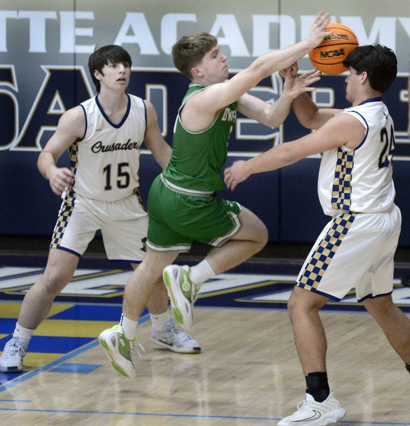 Dwight’s Collin Bachand  has his pass broken up by Marquette’s Matthew Graham  in the 1st period Monday at Marquette.