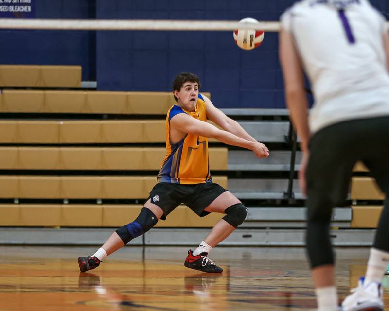 Lyons Connor Carroll (1) with a dig save during Oswego Sectional final between Downers Grove North at Lyons.  May 30, 2023.