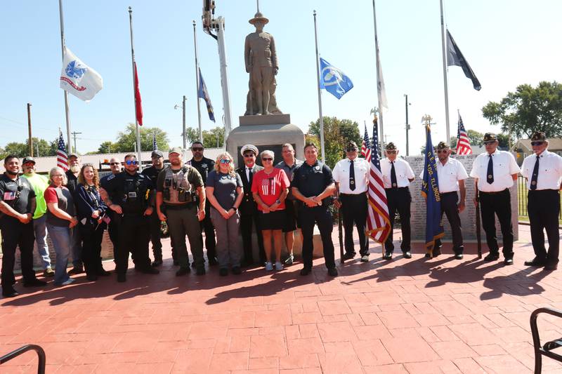 First responders pose for a photo during a 9/11 memorial ceremony on Thursday, Sept. 11, 2025 at the Veterans Park in Ladd.