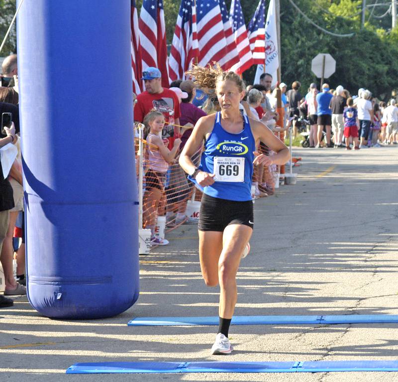 Melissa Winchester of Grand Rapids, Mich., is the first woman across the finish line at the 2025 Reagan Run 5K with a time of 19:15.83.