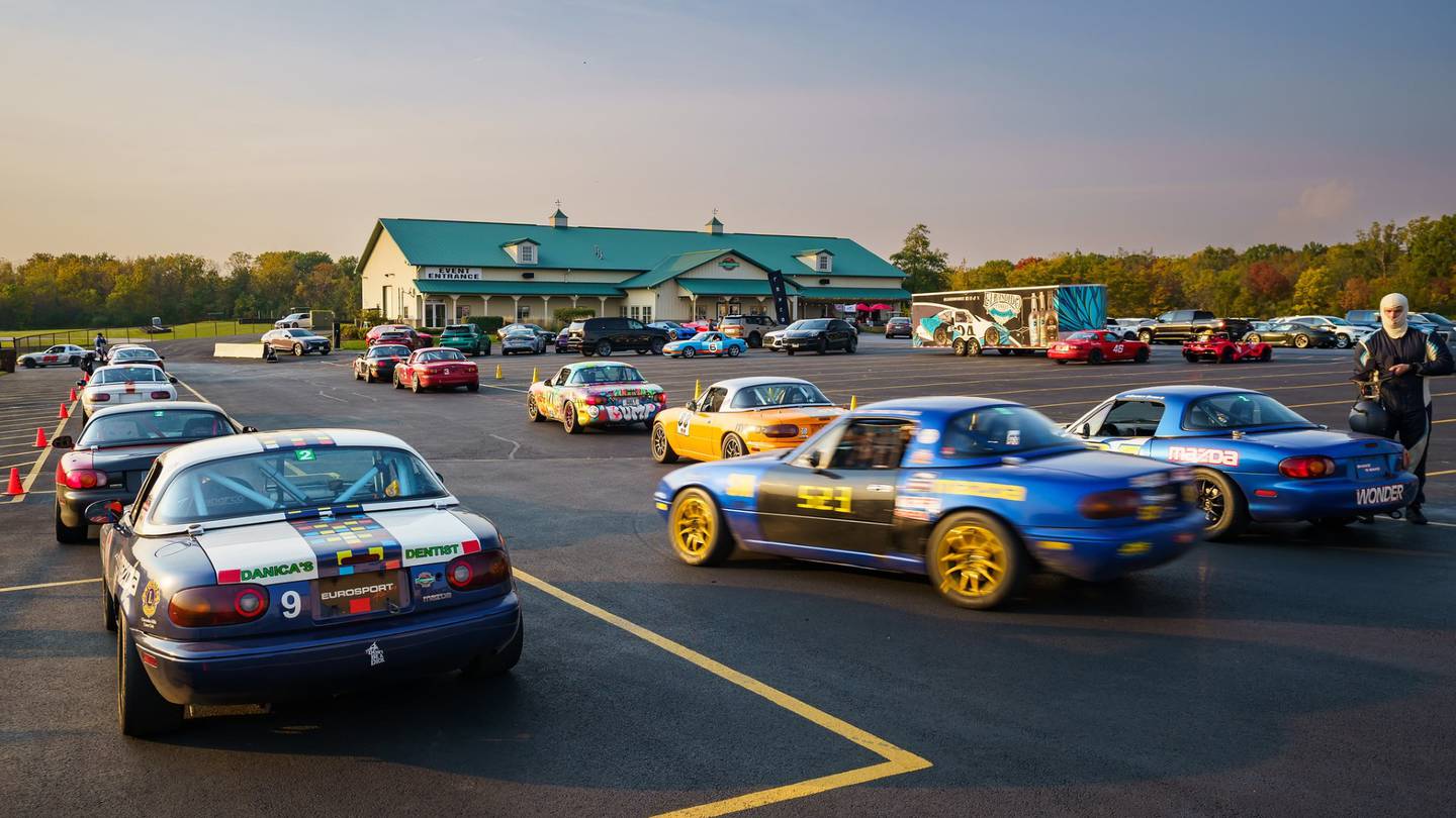 Race cars owned by members of the Autobahn Country Club in Joliet seen in the parking lot outside the clubhouse at a 20th anniversary celebration on Oct. 12, 2024.