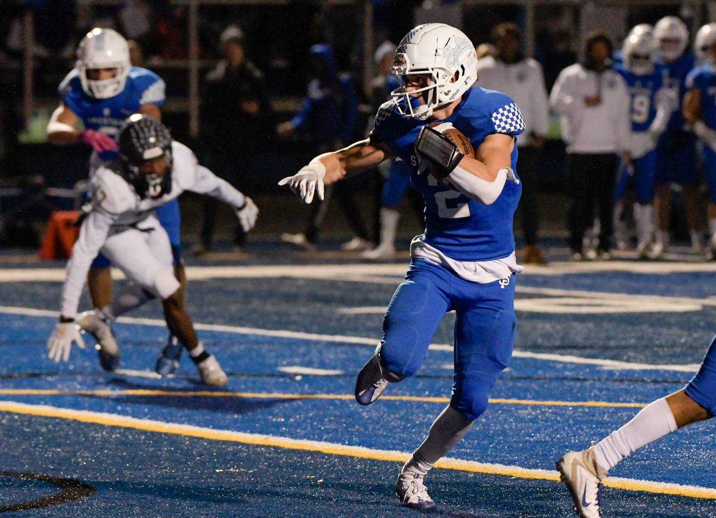 St. Francis' Adam Criter (2) runs the ball in for a first quarter touchdown against IC Catholic Prep during a game in Wheaton on Friday, October 22, 2021.