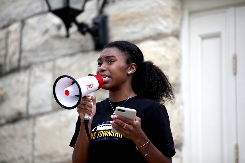 Mya Jackson, 18, a recent graduate of Lyons Township High School speaks during a Black Lives Matter rally in Western Springs on June 10. Participants then marched from the Western Springs Tower Green to the Lyons Township High School South Campus.