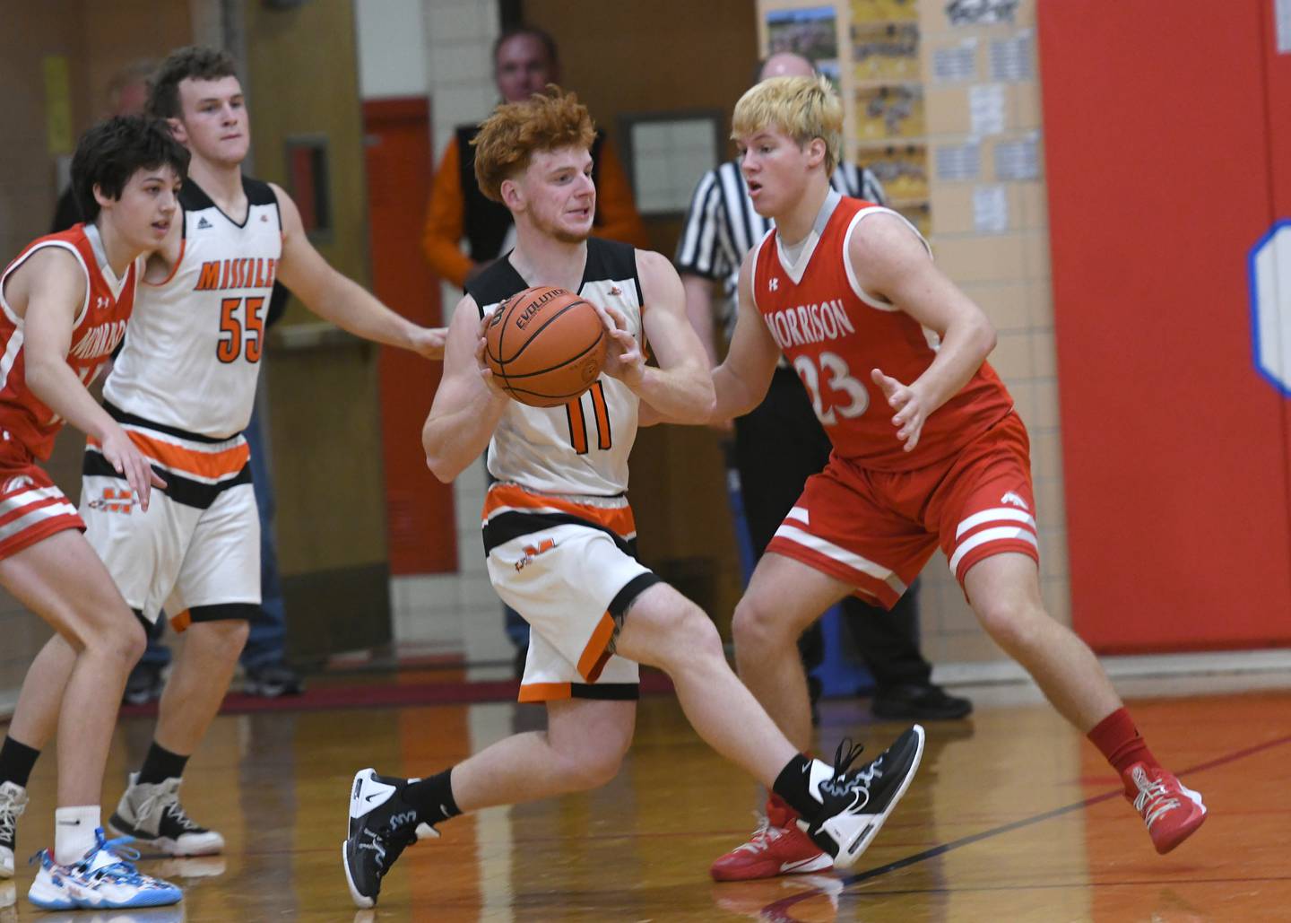 Milledgeville's Connor Nye makes a pass as Morrison's Carson Strating defends during Friday, Nov. 25 action at the Oregon Thanksgiving Tournament.