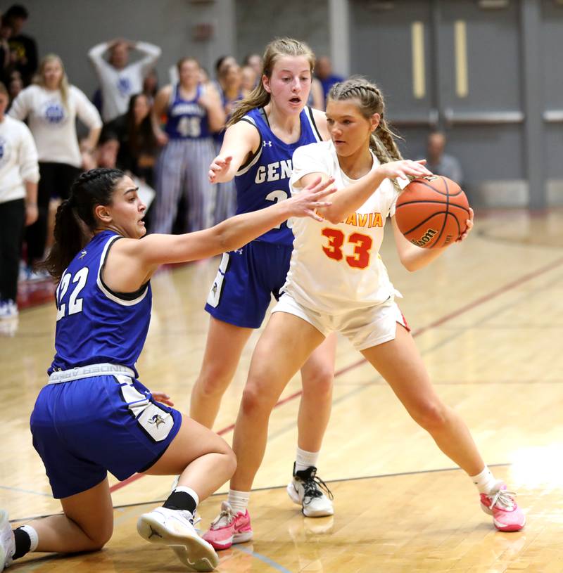 Batavia’s Natalie Warner is swarmed by Batavia’s Leah Palmer (left)  and Caroline Madden during the Class 4A Batavia Sectional final on Thursday, Feb. 22, 2024.