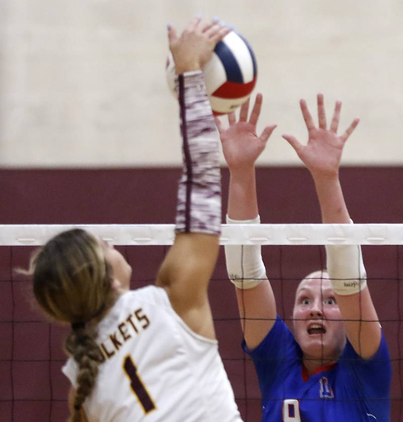Lakes’ Sammi Madsen series to block the spike of Richmond-Burton's Sophia Komar during a nonconference volleyball match on Monday, Sept. 29, 2025, at the Richmond-Burton High School in Richmond.