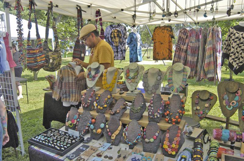 Luis Pesantez Tello works at his display at Nuts About Art on Saturday, June 5, at the Dixon Petunia Fest.
