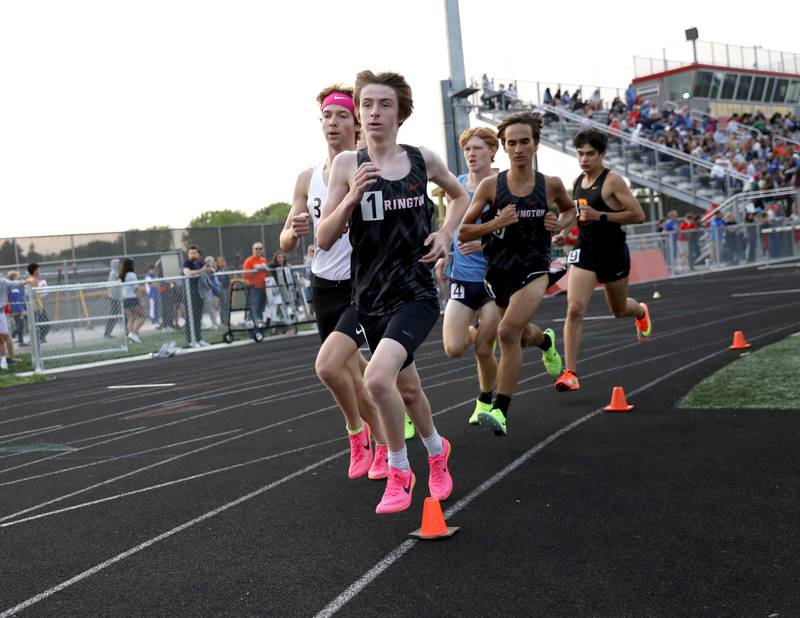 Barrington’s Joe Bregenzer (right) and St. Charles East’s Mitch Garcia lead the pack in the second heat of the 3,200-meter run during the Class 3A Batavia track and field sectional on Thursday, May 18, 2023.