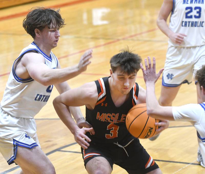 Milledgeville's Konner Johnson (3) moves to the basket as Sterling Newman players defend on Saturday, Dec. 13, 2025 at the 64th Annual Forreston Holiday Basketball Tournament at Forreston High School.