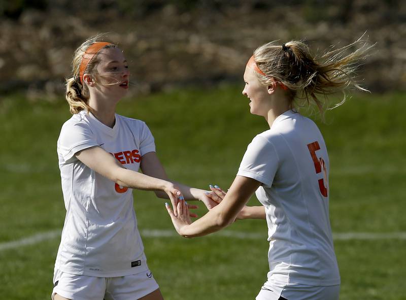 Crystal Lake Central's Carter Thompson congratulates her teammate, Lizzie Gray, after Gray scored a goal during a Fox Valley Conference soccer match Tuesday April 26, 2022, between Crystal Lake Central and Dundee-Crown at Dundee-Crown High School.