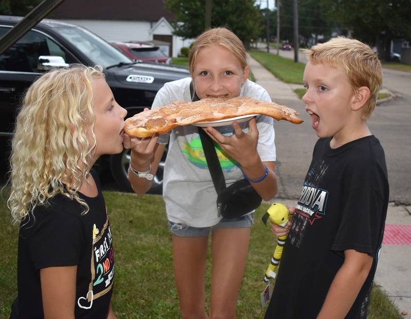 How do you eat a very big elephant ear? Get some help from your friends. That's what Rosalee Murray, Kinlee Prins, and Jared Prins did at the Whiteside County Fair on Thursday, Aug. 15, 2024.
