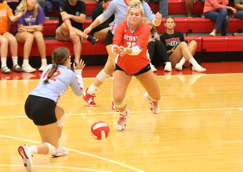 The ball drops between Ottawa's Haley Waddell and libero Reese Burgwald on Thursday, Sept. 21, 2023 at Kingman Gym.