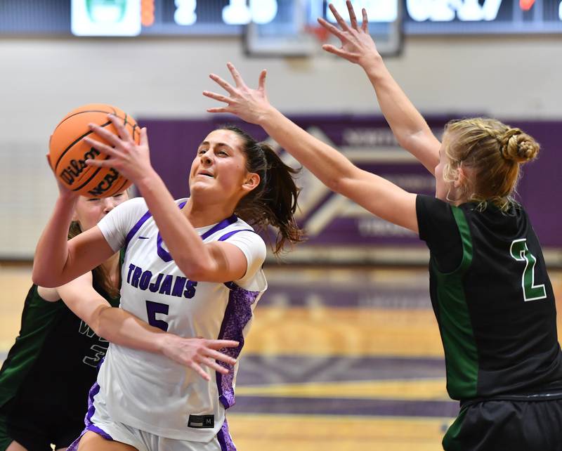 Downers Grove North’s Campbell Thulin (5) breaks through the relentless defense that Glenbard West maintained on her for most of the game on January 17, 2026 at Downers Grove North High School in Downers Grove .