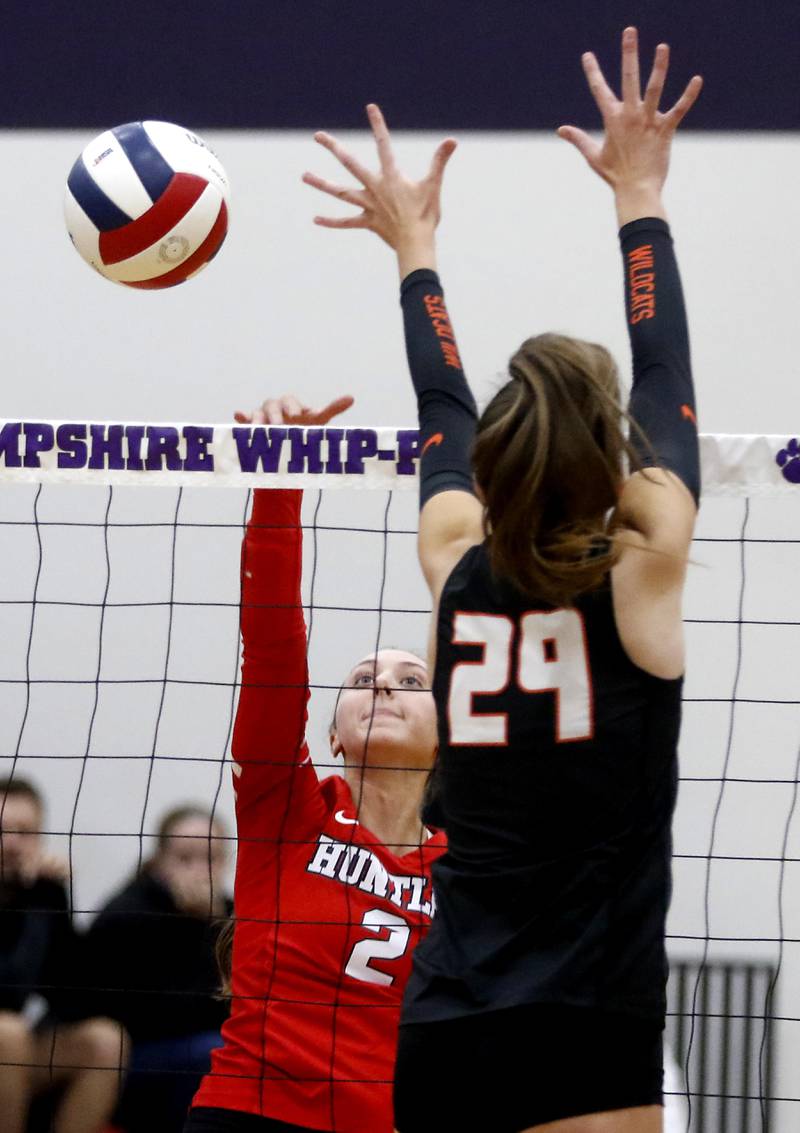 Huntley's Rachael Hein tries to hit the ball pas the block of Libertyville's Claire Evans during an IHSA Class 4A Hampshire Sectional semifinal volleyball match on Tuesday, Nov. 4, 2025, at Hampshire High School.