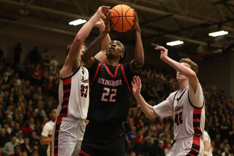 Bolingbrook’s Jeremy McCullum works under the basket against Benet in the Class 4A Bolingbrook Sectional championship game on Friday, March 6, 2026 in Bolingbrook.