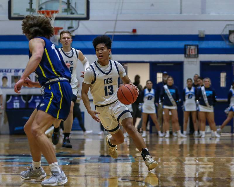 Downers Grove South's Richard Gasmen (13) drives down the court during basketball game between Leyden at Downers Grove South. Feb 9, 2024.