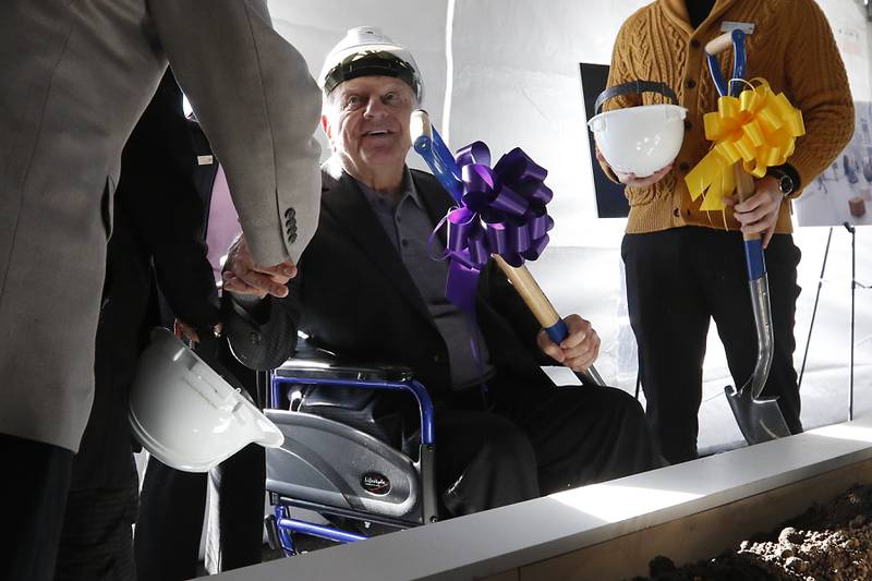 Former Sage Products Chairman and CEO and current Foglia Family Foundation Vice President Vince Foglia shakes hands Wednesday, Oct. 19, 2022, during a groundbreaking ceremony for McHenry County College’s Foglia Center for Advanced Technology and Innovation at the Crystal Lake campus.  During the ceremony, speakers spoke about the future of learning in the new center along with education's role in economic development.