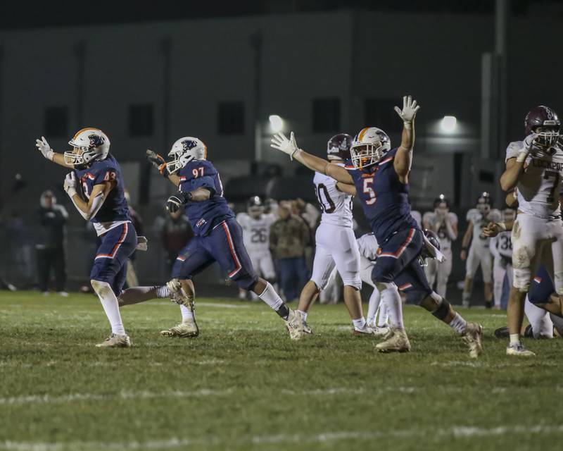 Oswego celebrates their win over Lockport after a missed a last second field goal attempt during Class 8A semifinal football game between Lockport at Oswego. Saturday, Nov 22, 2025 in Oswego.