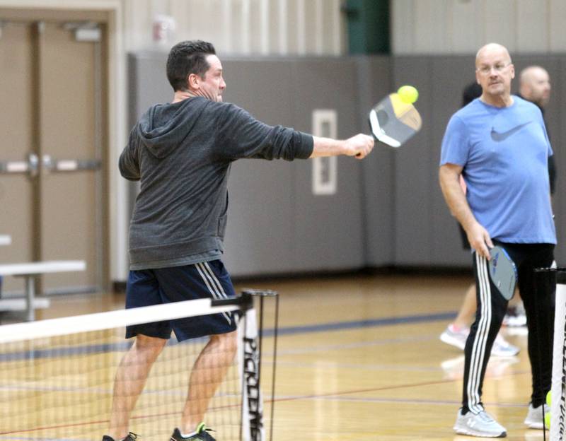 Mike Schrettenbruenner of Geneva returns the ball over the net during a pickle ball open gym session at the Stephen D. Persinger Recreation Center in Geneva on Jan. 12, 2023.