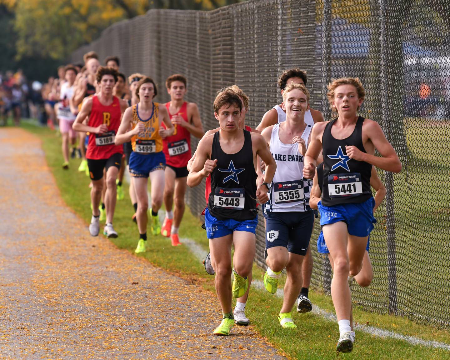 St. Charles North Logan Hitchings, 5443, and teammate Christian Enger, 5441, lead a pack of runners during the DuKane Conference meet on Saturday Oct. 18, 2025, held at Lake Park High School east campus.