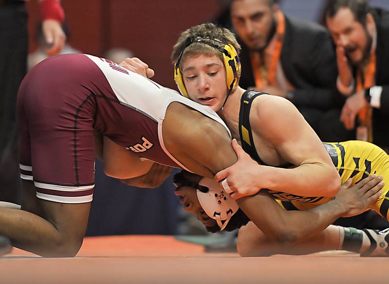 Joliet West's Carson Weber, top, and Lockport's Justin Wardlow wrestle in the Class 3A 150-pound final at the IHSA boys state wrestling championships at the State Farm Center in Champaign on Saturday, Feb. 22, 2025.