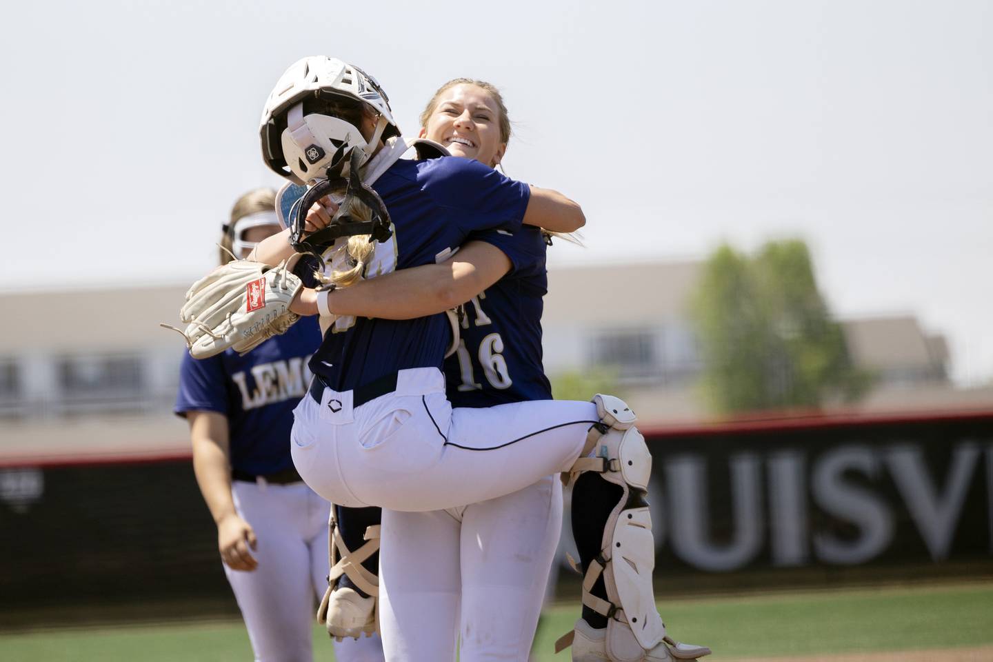 Lemont’s Sage Mardjetko hugs her catcher after winning 10-0 over Benet Academy Friday, June 9, 2023 in the class 3A state softball semifinal.