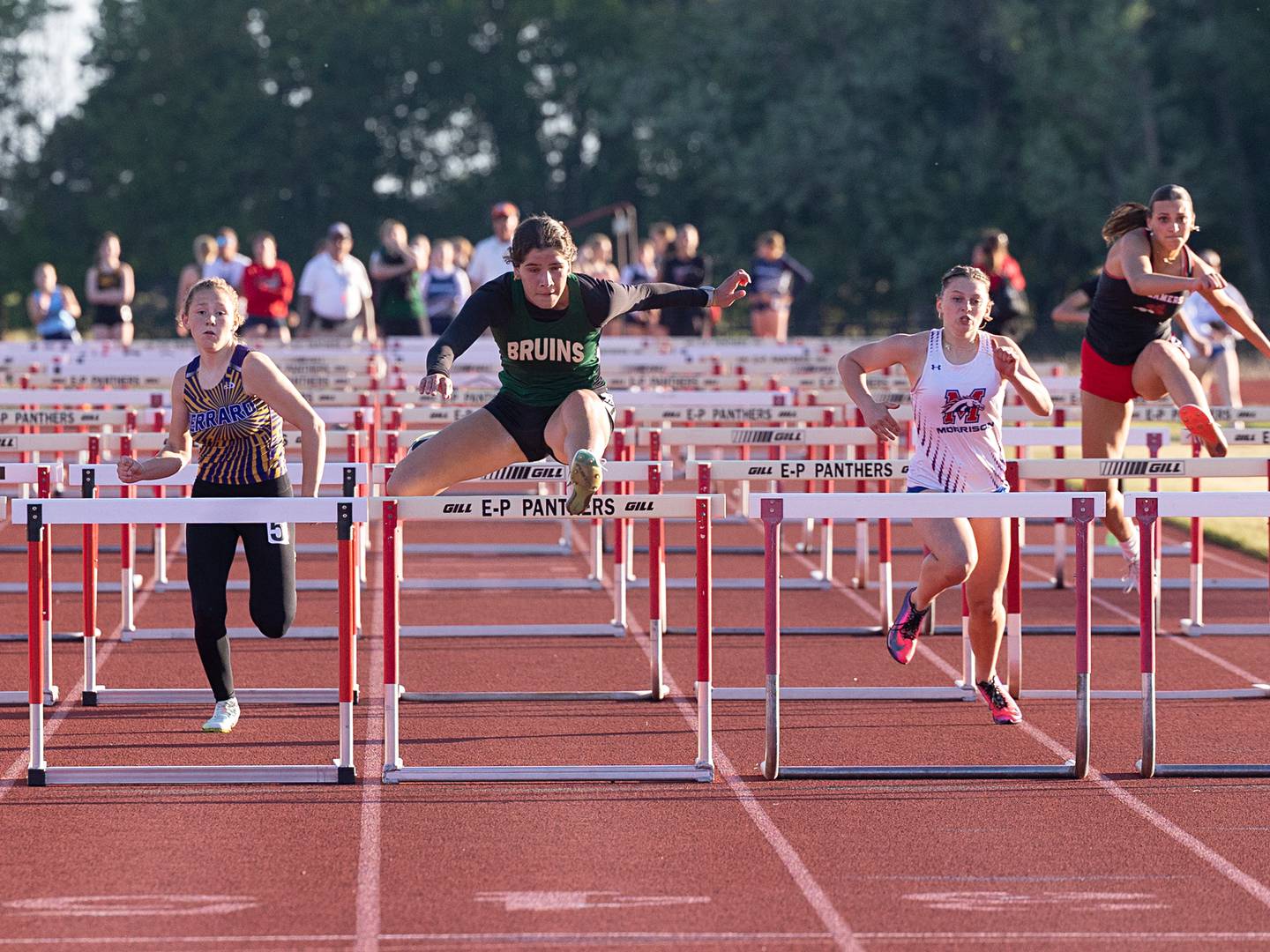 St. Bede’s Lily Bosnich clears the final hurdle for a win in the 100 hurdles Wednesday, May 13, 2026, during the Class 1A Erie Sectional meet.