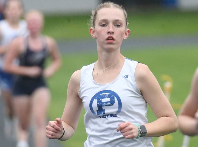 Princeton's Payton Frueh competes in the 3200 meter run during the Class 2A girls track and field Sectional on Thursday, May 9, 2024 in Princeton.