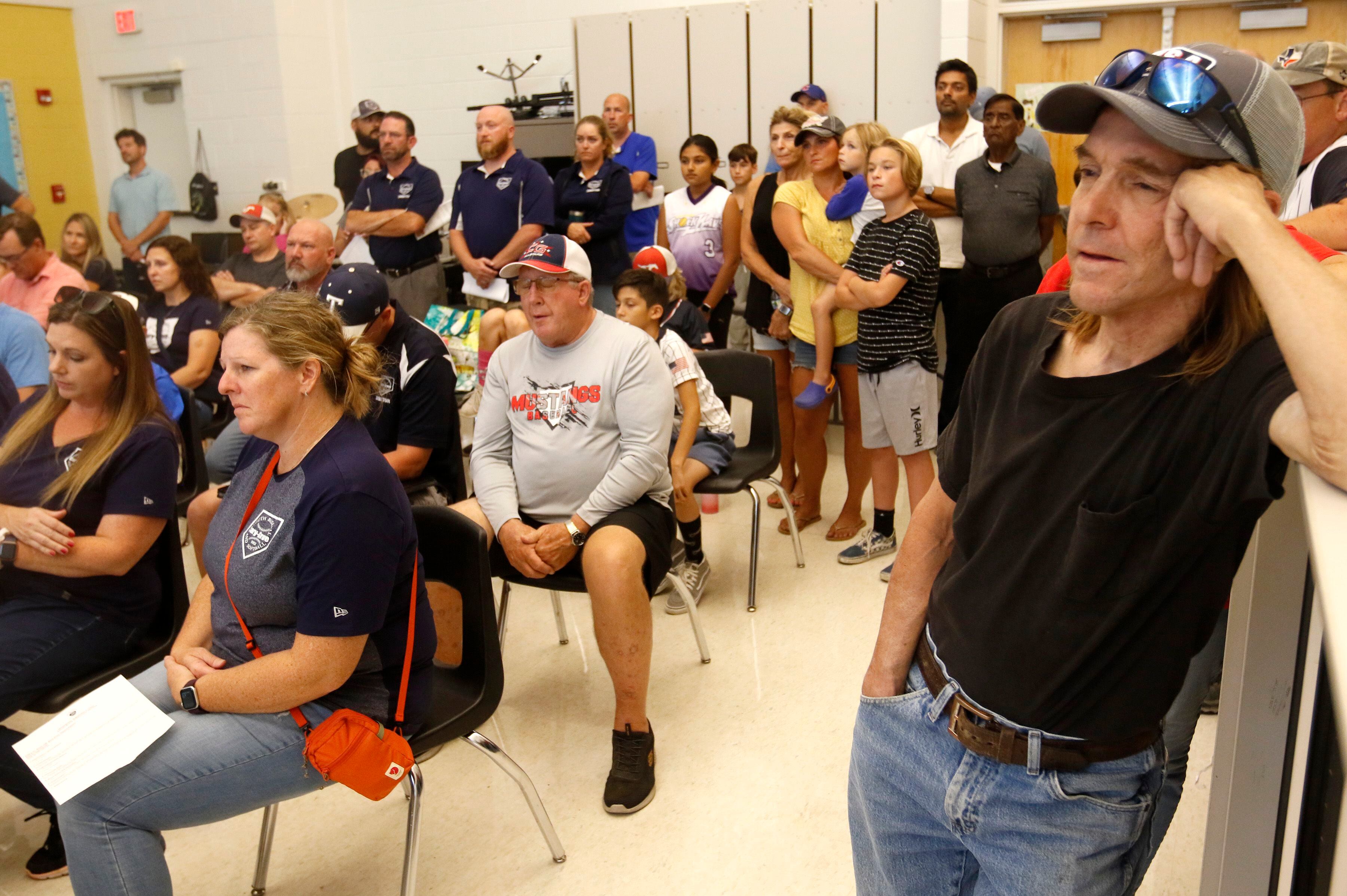 People listen to a board discussion during a Cary School District 26 Special Board of Education Meeting last September about plans for the transportation project, the demolition of Maplewood School and the need to relocate youth baseball and softball fields.